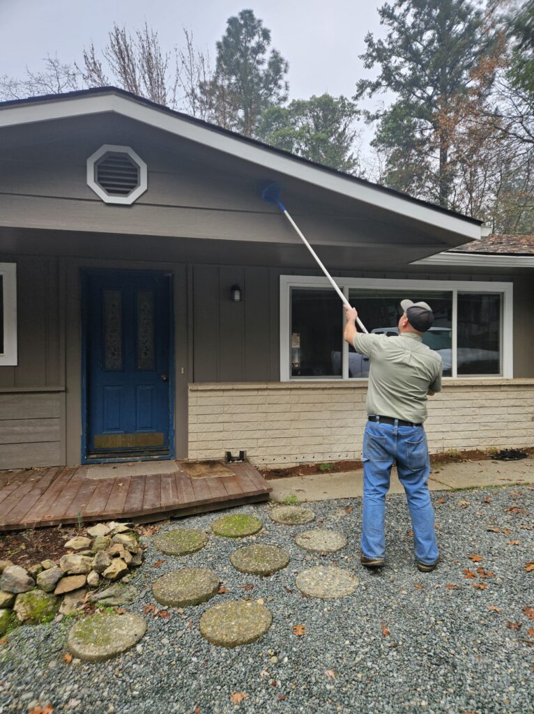 VIP Tech cleaning spider webs | residential pest control | Grants Pass, Or.